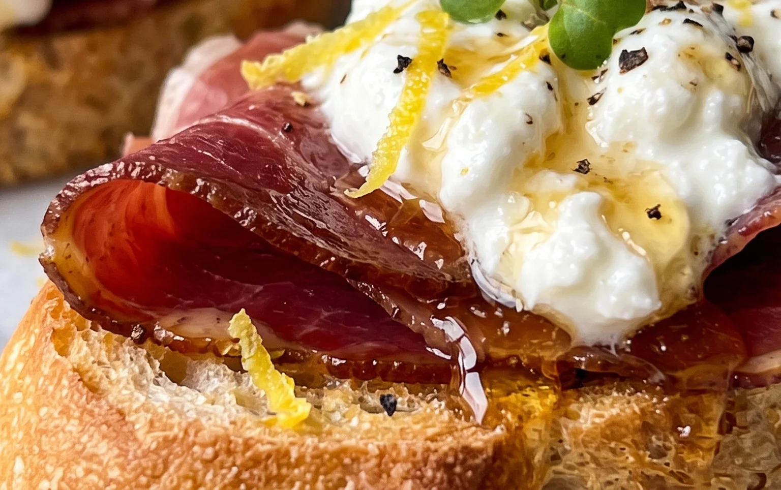 Beef Prosciutto Crostini with Burrata and Lemon Honey Drizzle