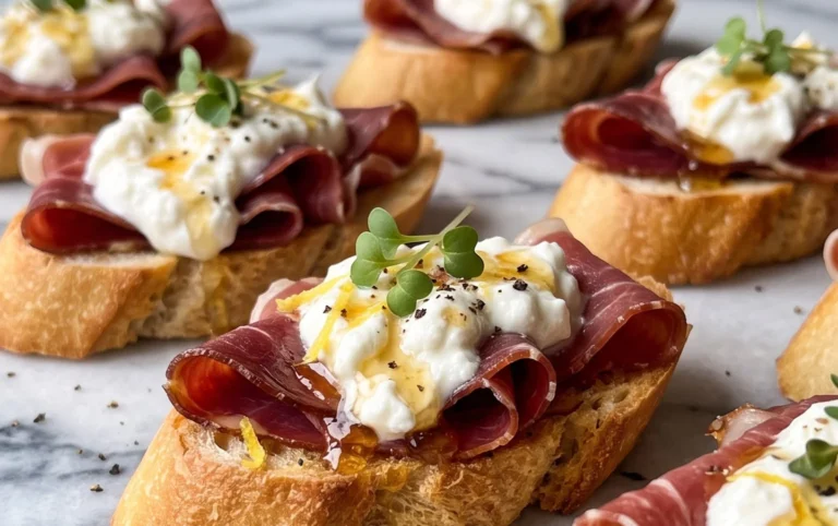 Beef Prosciutto Crostini with Burrata and Lemon Honey Drizzle